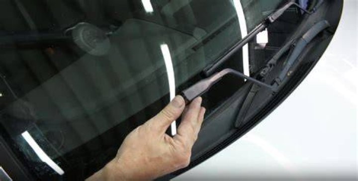 Where is the button for windshield wipers?